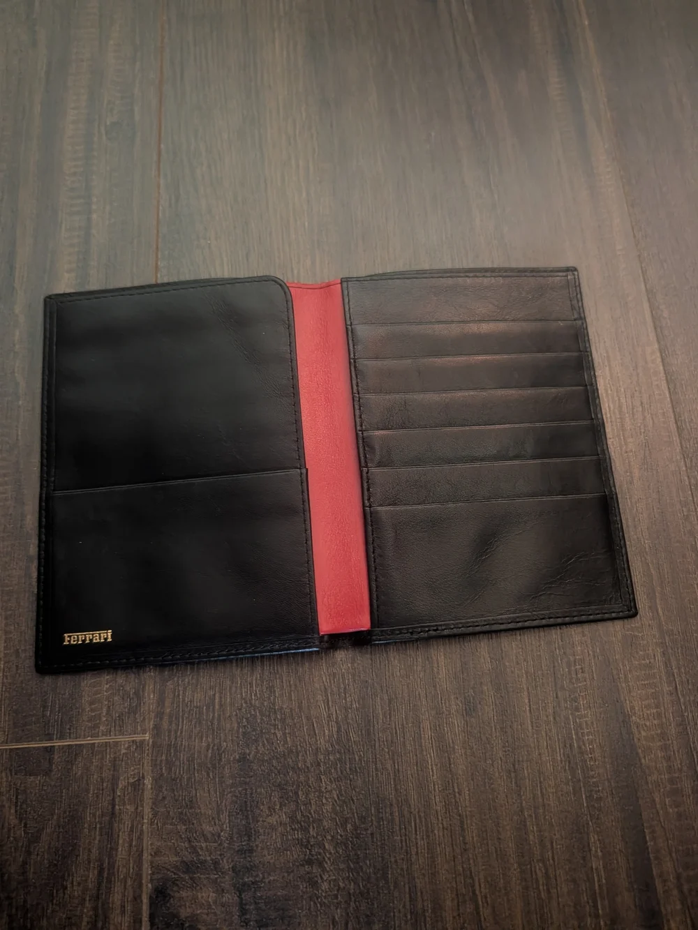FERRARI Black Leather Passport Wallet with Embossed Shield Logo Red Inside